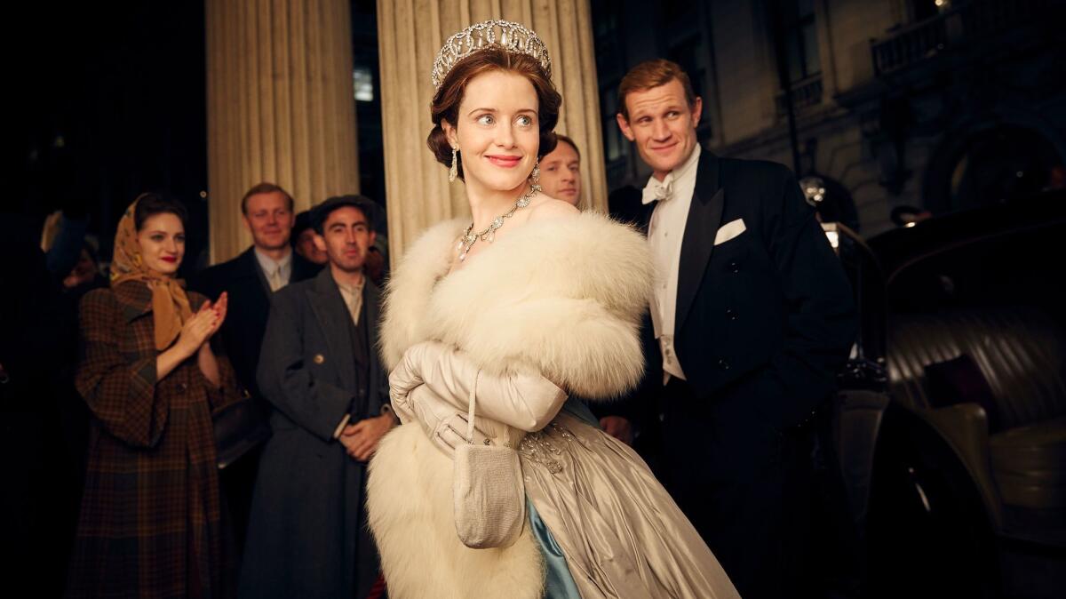 Claire Foy, center, and Matt Smith, right, in "The Crown."