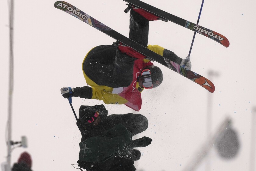 Finland's Jon Sallinen collides with a cameraman during the men's halfpipe qualification at the 2022 Winter Olympics, Thursday, Feb. 17, 2022, in Zhangjiakou, China. (AP Photo/Francisco Seco)