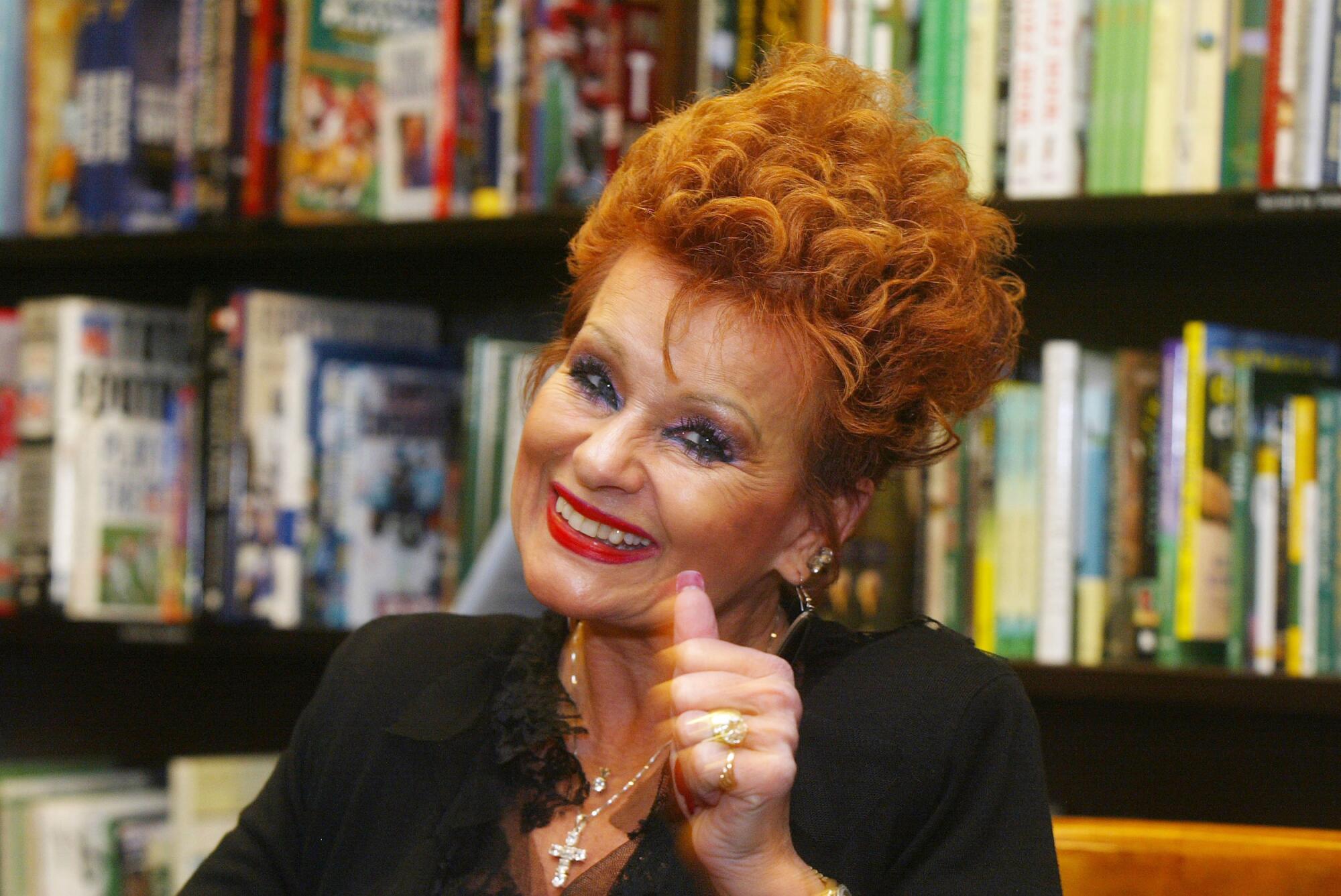 Televangelist Tammy Faye Bakker gives a thumbs up