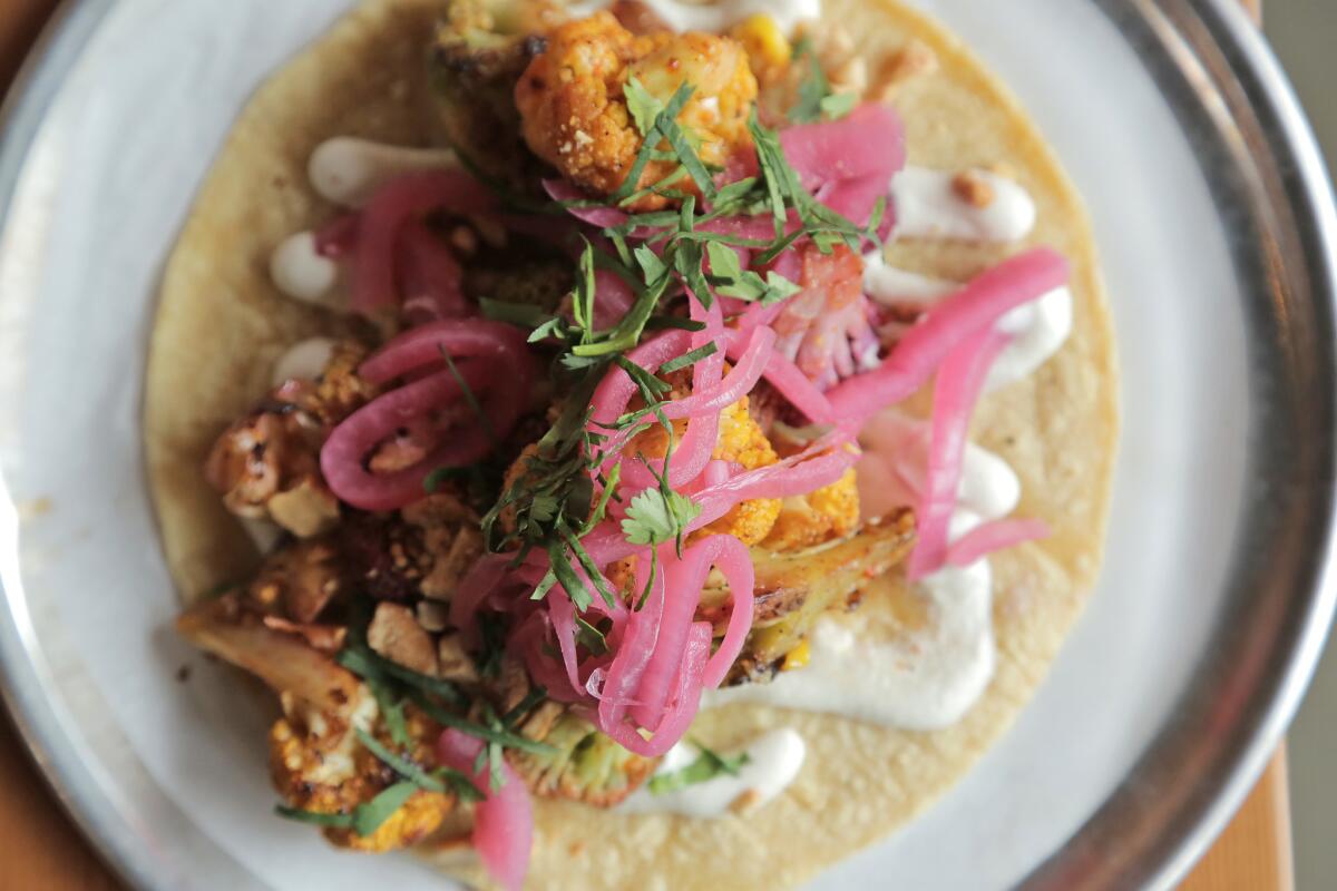 The rainbow cauliflower taco with grilled corn and cashew purée is a vegan-friendly menu item at Trejo's Cantina in Hollywood.