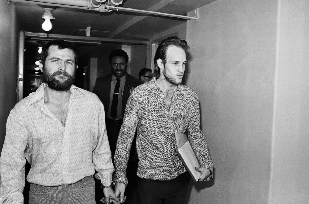 Bruce Davis, left, and Steve Grogan, leave court in 1970 after a court hearing. Gov. Jerry Brown denied Davis' parole Friday. It was the third time a California governor rejected the parole board's recommendation to release Davis.