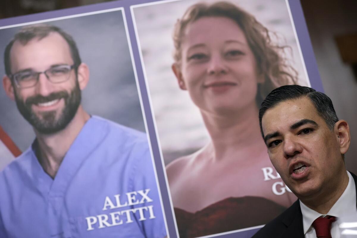 Rep. Robert Garcia (D-CA) speaks in front of a poter with photos of Alex Pretti and Renee Good