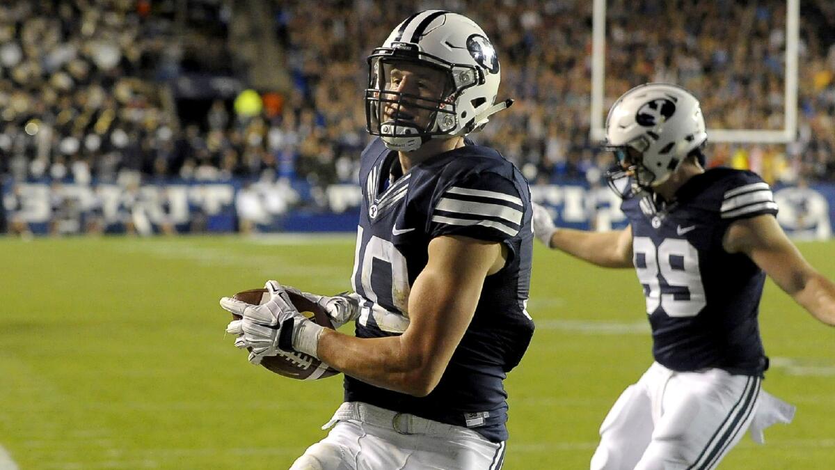 BYU receiver Mitch Mathews scores his second touchdown in the fourth quarter against Connecticut on Friday night.