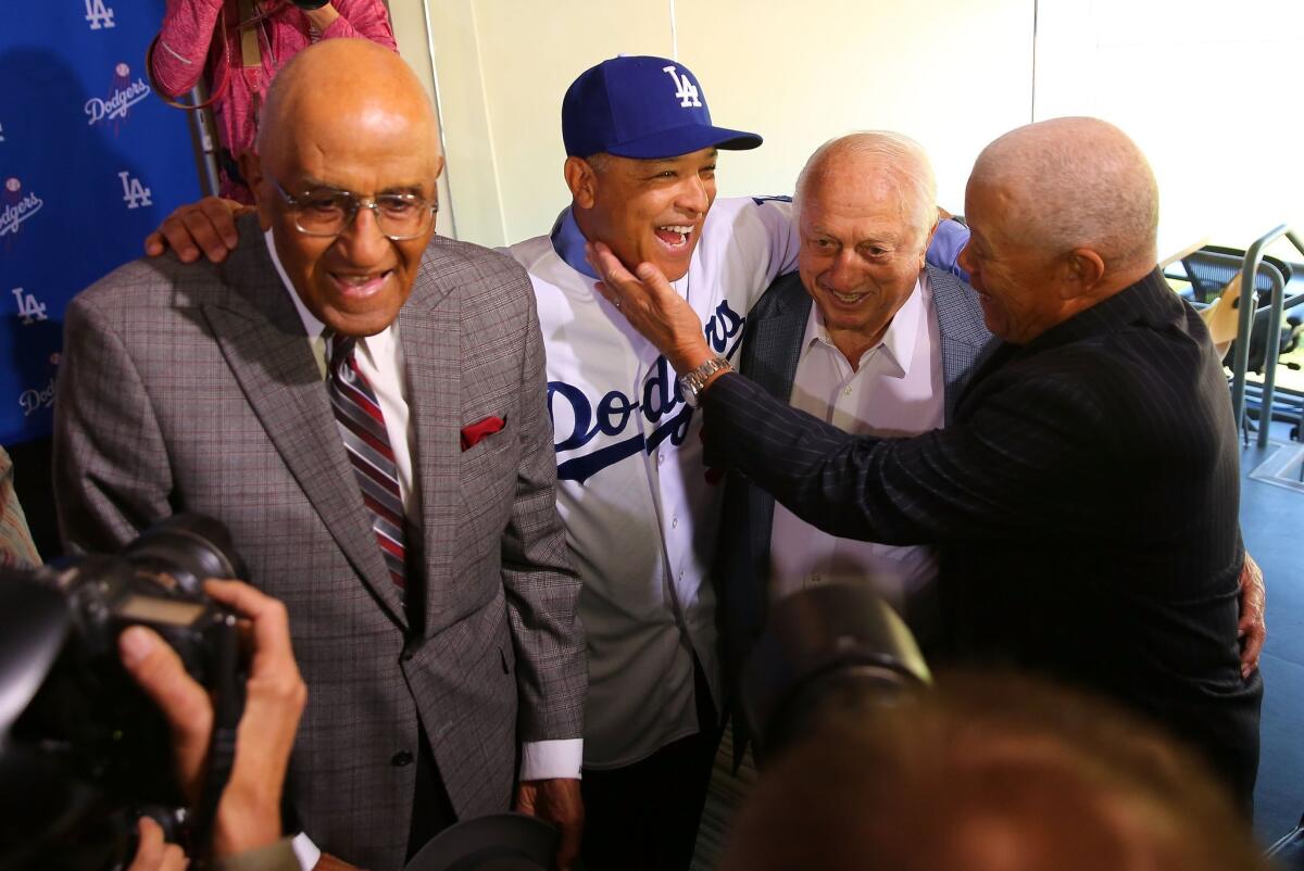 Dodgers great Don Newcombe, left, at Dodger Stadium with former Dodgers player Maury Wills, right, former Dodgers manager Tommy Lasorda, second from right, and new Dodgers manager Dave Roberts.