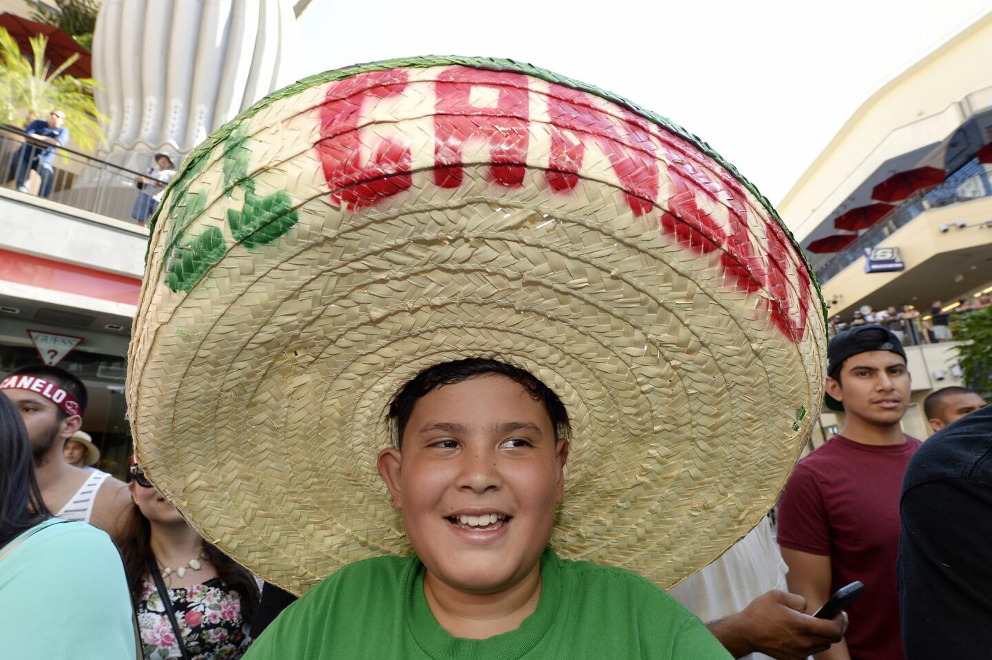 LOS ANGELES, CA - AUGUST 24: A fan of boxer Canelo Alvarez, former WBC and WBA Super Welterweight World Champion, wears a large sombrero hat during a news conference for the announcement of the WBC middleweight title bout between current WBC champion Miguel Cotto and Canelo Alvarez August 24, 2015, in Los Angeles, California. The WBC middleweight title bout will take place November 21 at the Mandalay Bay Events Center in Las Vegas, Nevada. (Photo by Kevork Djansezian/Getty Images) ** OUTS - ELSENT, FPG - OUTS * NM, PH, VA if sourced by CT, LA or MoD **