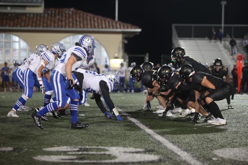 The La Jolla Country Day School Torreys (in white) square off against the Bishop's School Knights (in black) on Sept. 30.