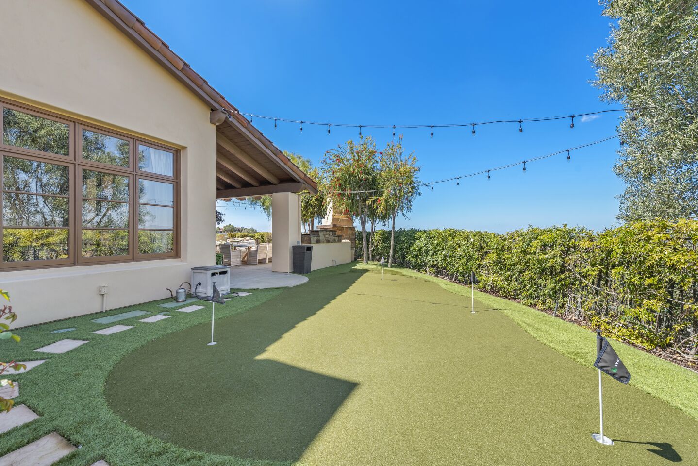 The house has a putting green.