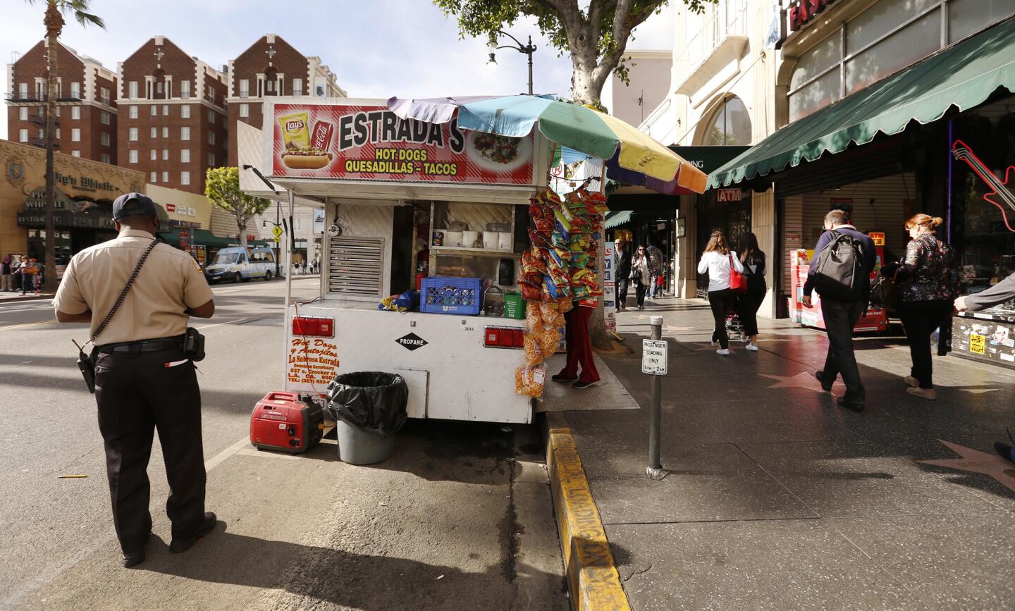A food truck is set up outside the Hollywood Boulevard pizza shop Stefano's Two Guys From Italy.