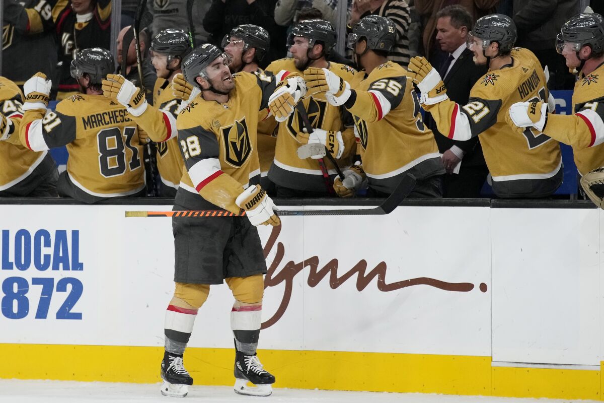 Vegas Golden Knights left wing William Carrier (28) celebrates after scoring against the San Jose Sharks during the third period of an NHL hockey game Thursday, Feb. 16, 2023, in Las Vegas. (AP Photo/John Locher)