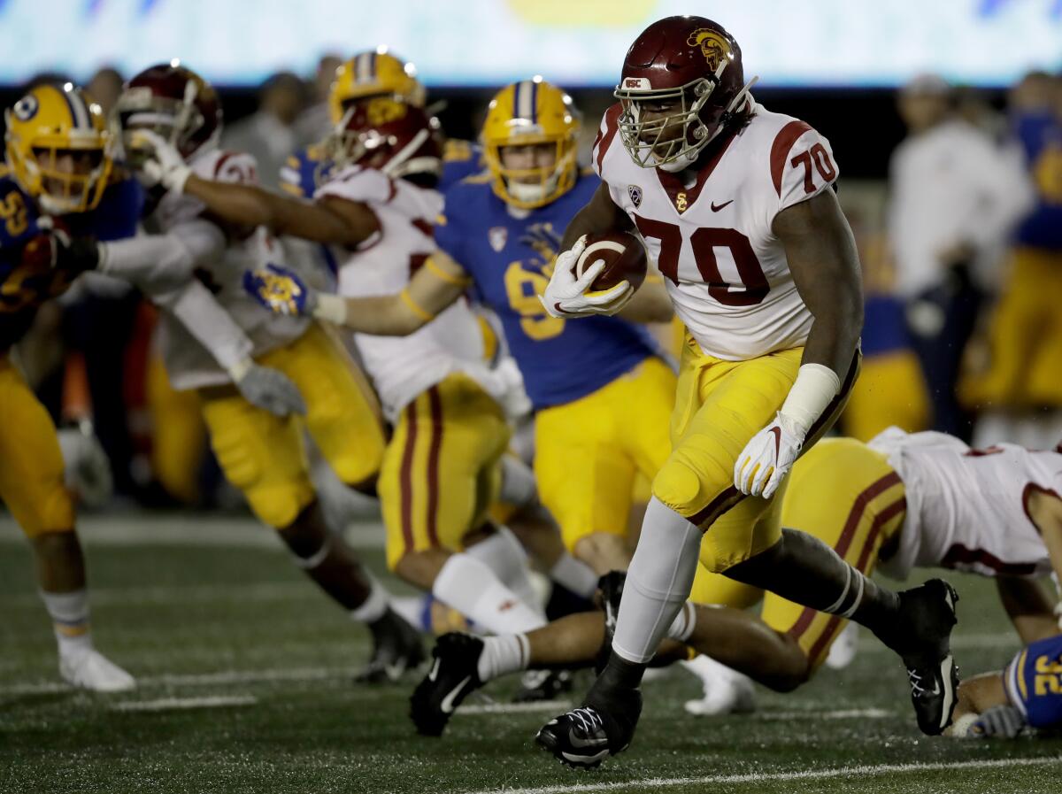 USC's Jalen McKenzie carries the ball during the first quarter.