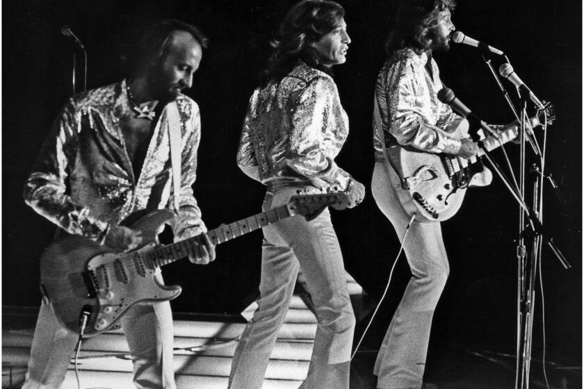 July 7, 1979: The Bee Gees perform at Dodger Stadium. From left are Maurice, Robin and Barry Gibb.