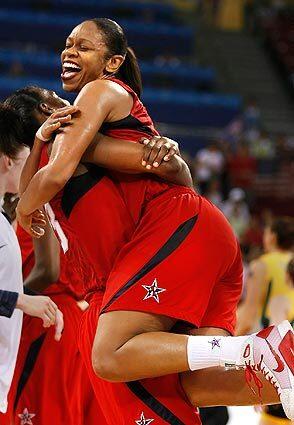 Tina Thompson embraces Sylvia Fowles as the U.S. women's basketball team wins the gold medal with a victory over Australia at the 2008 Beijing Olympics.
