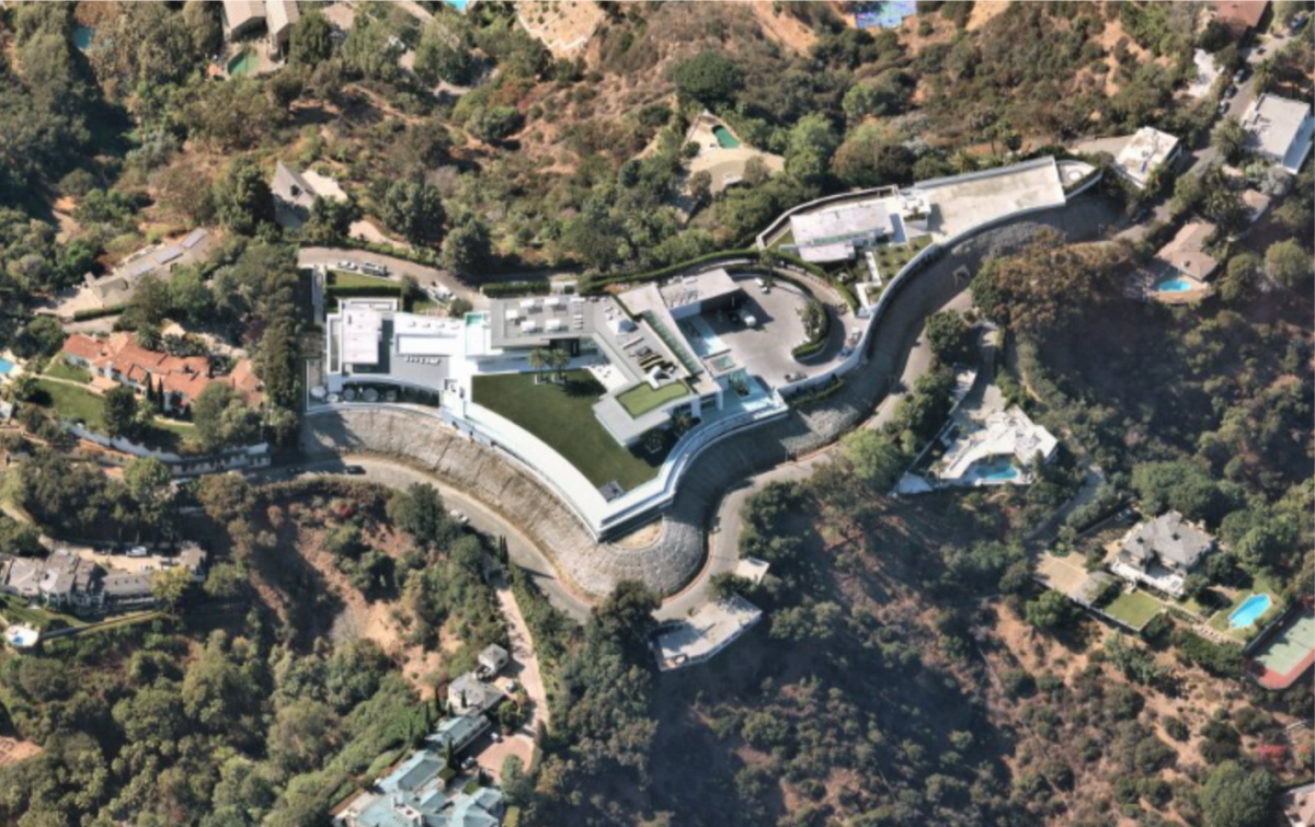 Aerial view of a house and swimming pools