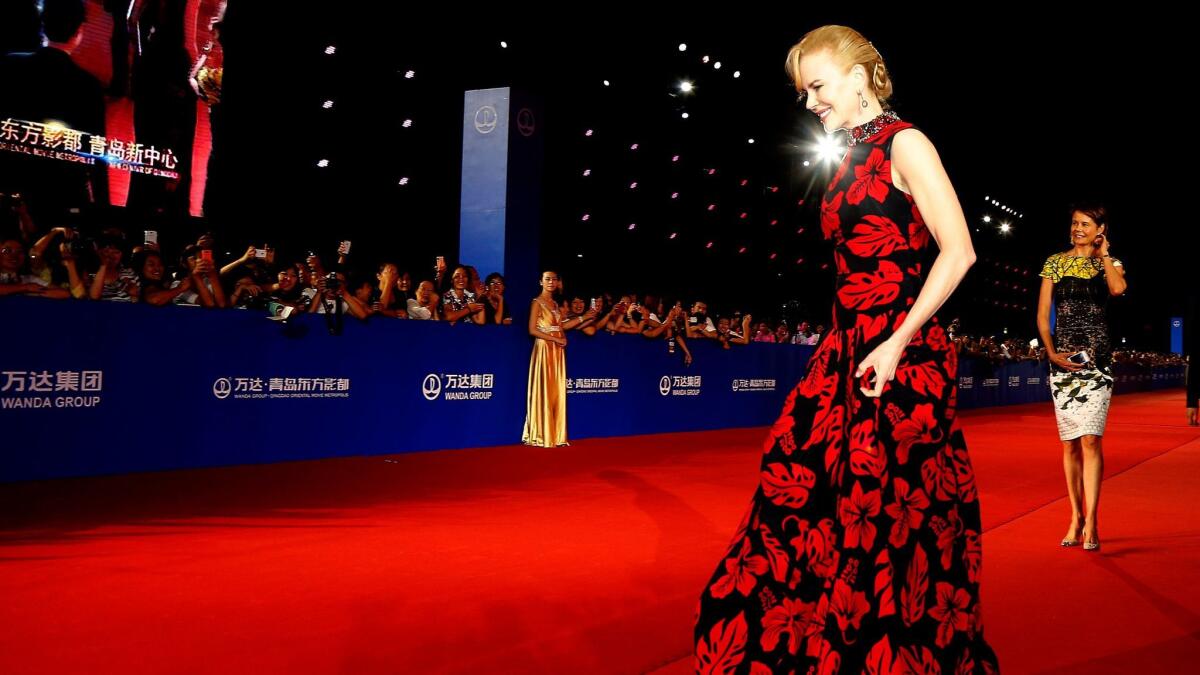 Nicole Kidman arrives on the red carpet during the opening night of the Qingdao Oriental Movie Metropolis in 2013.