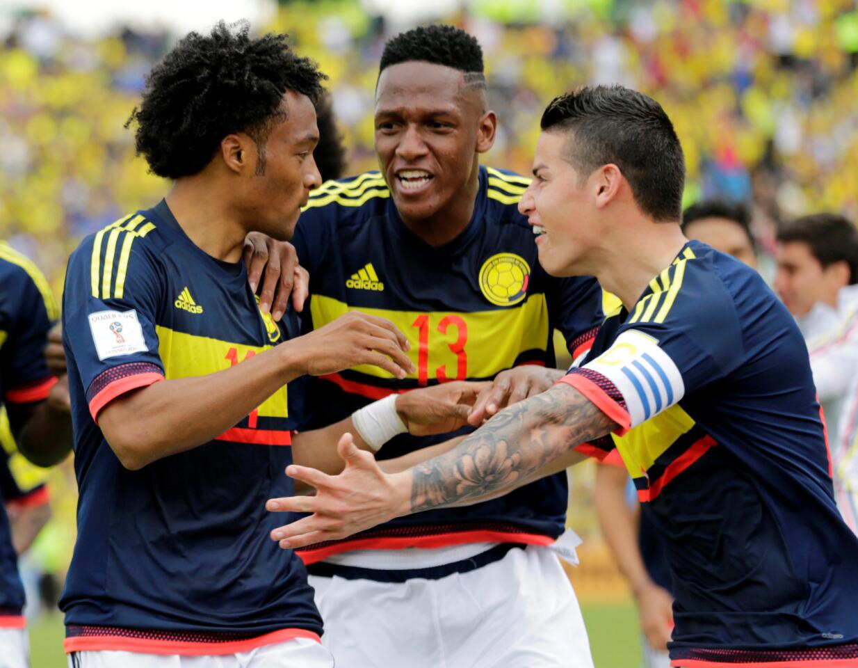 Football Soccer- Ecuador v Colombia- World Cup 2018 Qualifiers - Quito, Ecuador - 28/3/17. Colombia's Juan Cuadrado (L) celebrates with teammates after scoring against Ecuador. REUTERS/Henry Romero ** Usable by SD ONLY **