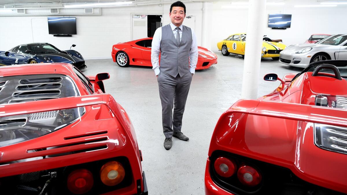 Entrepreneur David Lee poses with his Ferrari collection in Walnut.