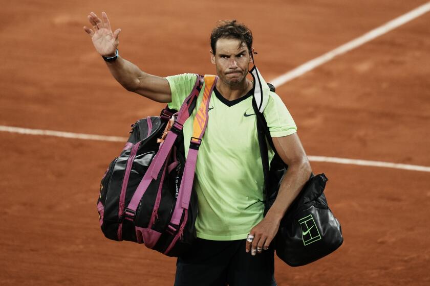 Spain's Rafael Nadal waves to the crowd after losing to Serbia's Novak Djokovic in their semifinal match of the French Open tennis tournament at the Roland Garros stadium Friday, June 11, 2021 in Paris. Djokovic won 3-6, 6-3, 7-6 (4), 6-2. (AP Photo/Thibault Camus)