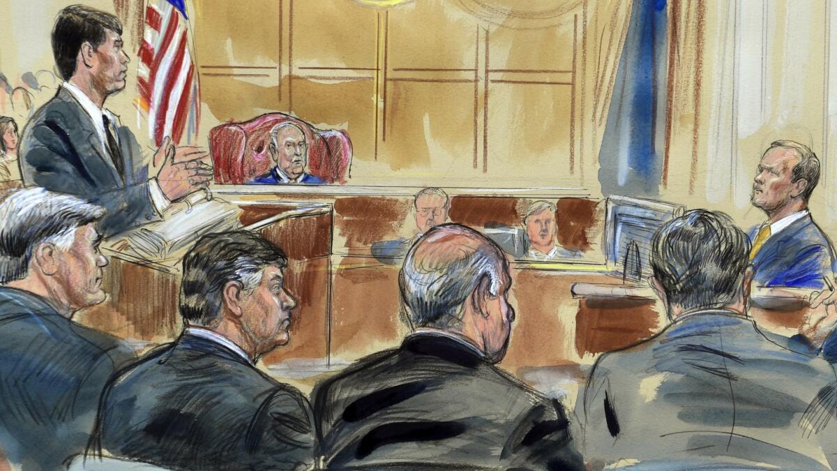 Richard Gates, right, answers questions from prosecutor Greg Andres as he testifies in the trial of Paul Manafort, seated second from left.