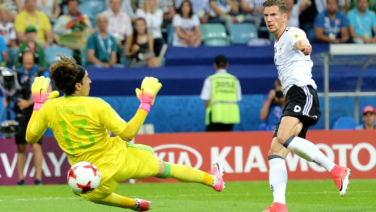 Leon Goretzka slips a shot past Mexico goalkeeper Guillermo Ochoa for his second goal of the Confederations Cup semifinal on Thursday.
