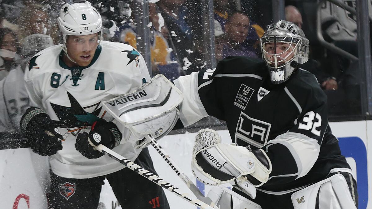 Kings goalie Jonathan Quick, right, makes contract with San Jose Sharks forward Joe Pavelski during a game at Staples Center on Oct. 8.