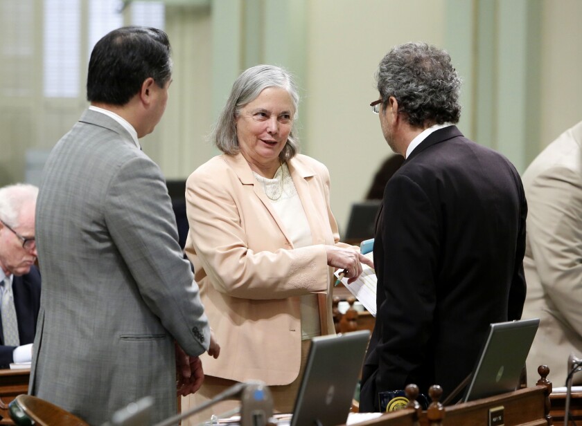 State Sen. Fran Pavley (D-Agoura Hills) talks with Assemblymen Philip Ting (D-Scotts Valley), left, and Richard Bloom (D-Santa Monica) before the Assembly voted on her fracking bill.