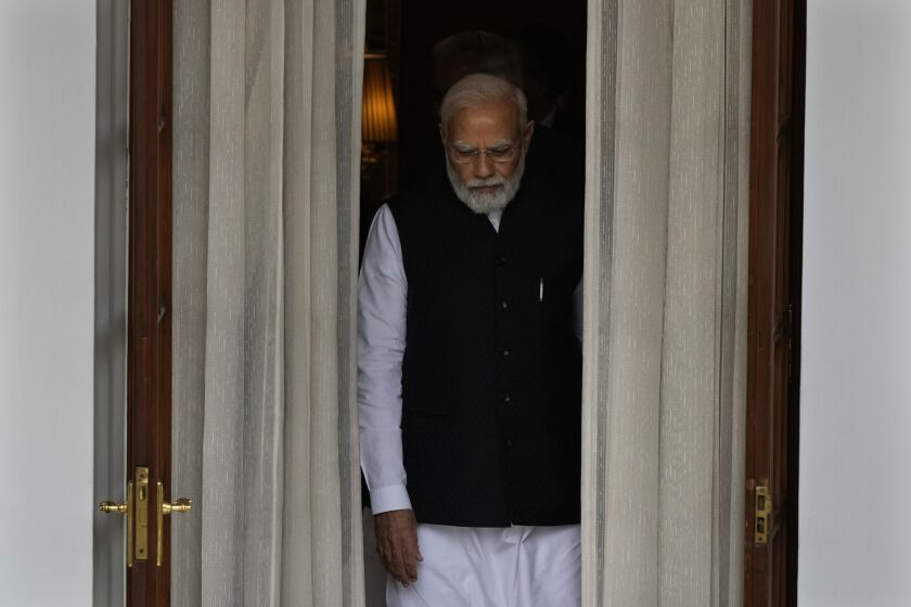 Indian Prime Minister Narendra Modi leaves to receive Nepal’s Prime Minister Pushpa Kamal Dahal before their meeting in New Delhi, India, Thursday, June 1, 2023. Dahal arrived Wednesday on a state visit, his first trip abroad since taking power in December last year. (AP Photo/Manish Swarup)