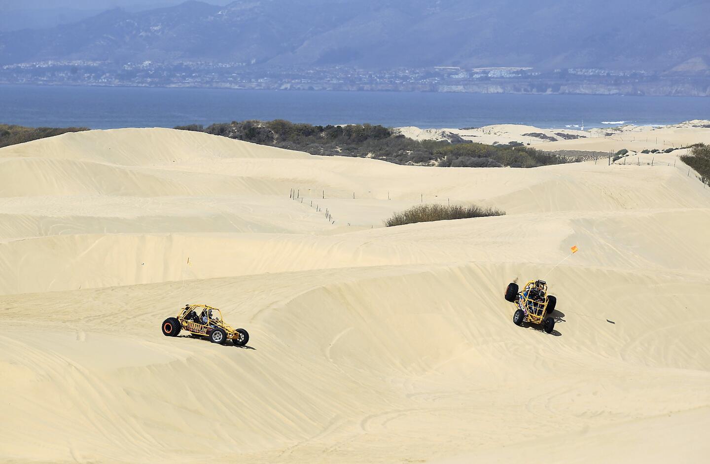 Off-roaders do their thing at Oceano Dunes. Many residents believe such activity makes particulate pollution worse in adjacent areas.