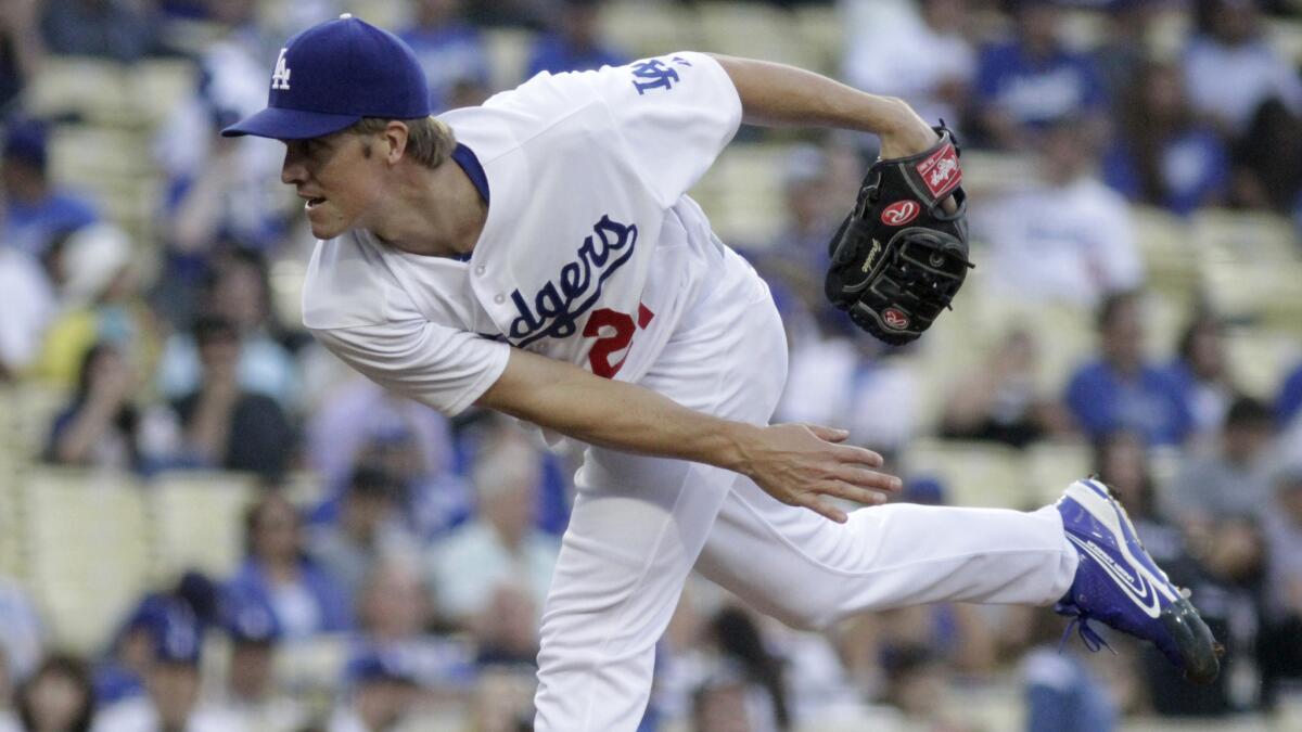Dodgers starter Zack Greinke delivers a pitch during Tuesday's game against the Cincinnati Reds at Dodger Stadium.
