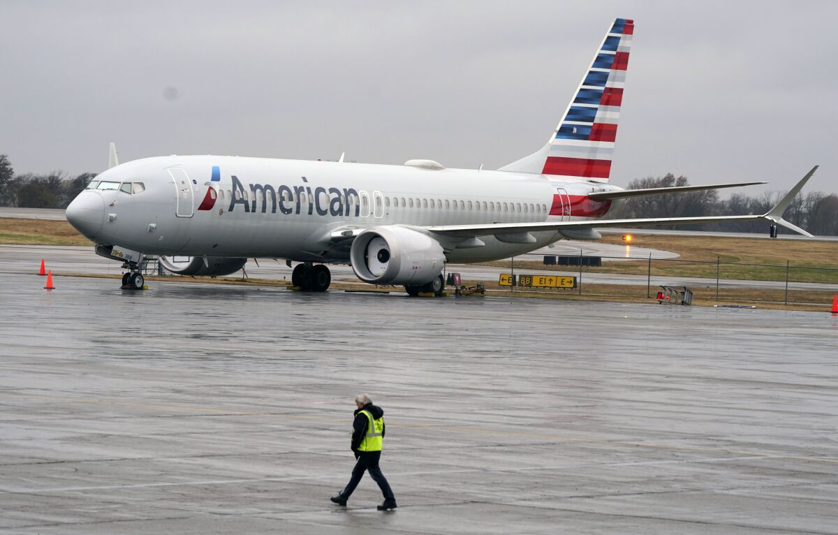FILE - An American Airlines Boeing 737 Max jet plane is parked at a maintenance facility in Tulsa, Okla., Wednesday, Dec. 2, 2020. A former Boeing test pilot pleaded not guilty Friday, Oct. 15, 2021, to charges that he deceived regulators by withholding information about a key system that played a role in two deadly crashes involving Boeing 737 Max jets. (AP Photo/LM Otero, File)