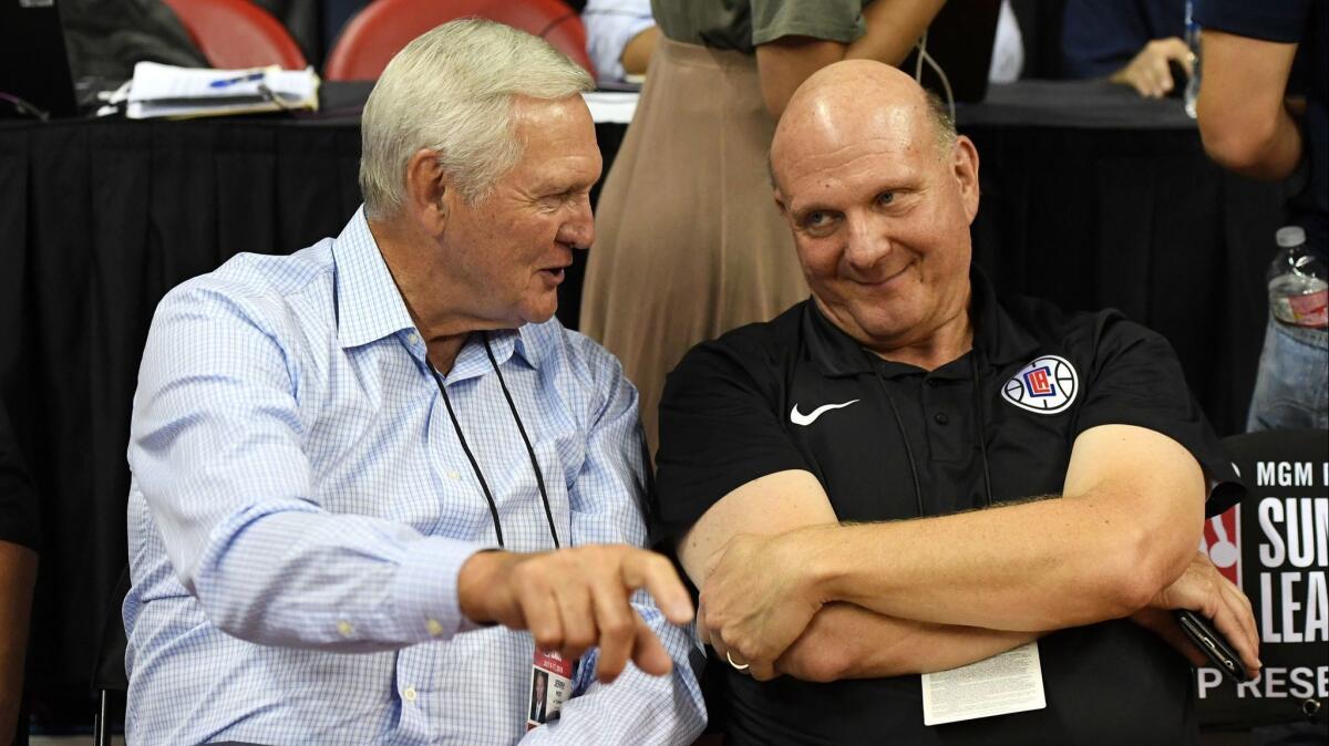 Jerry West, left, and Clippers owner Steve Ballmer talk during a 2018 NBA Summer League game in Las Vegas.