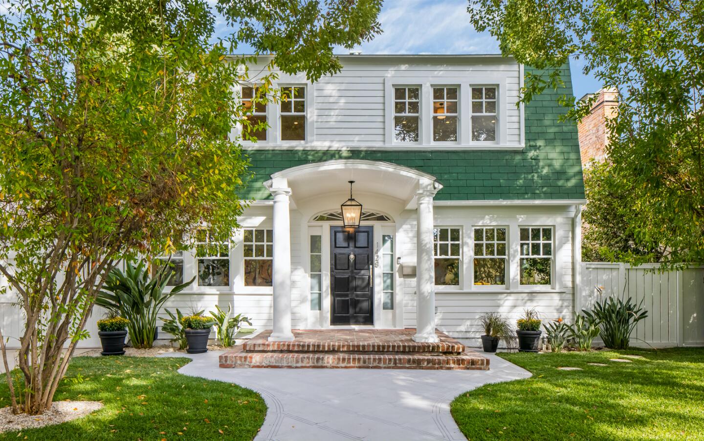 Built in 1919, the Dutch Colonial-style home still features the iconic green-shingled facade that appeared in the 1984 film.