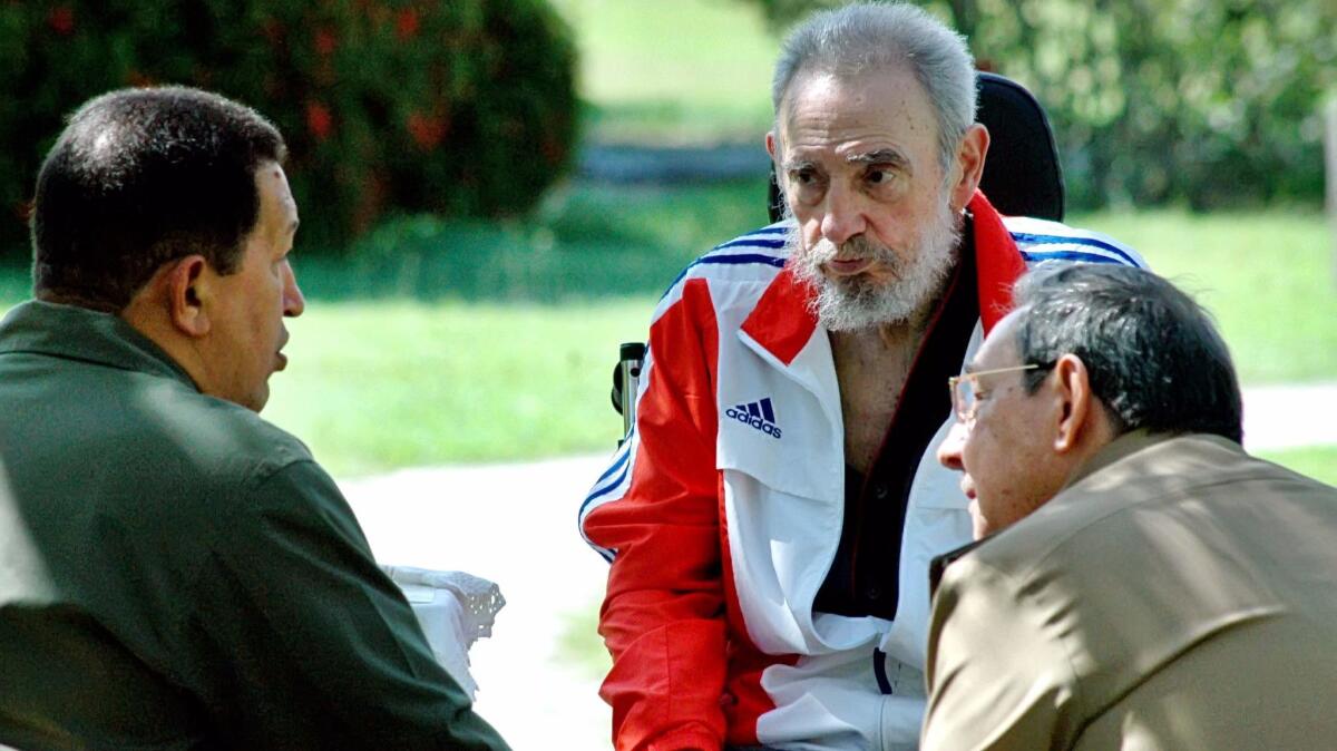 Venezuelan President Hugo Chavez, left, visits with former Cuban President Fidel Castro, center, and Castro's brother Raul, Cuba's current president, in Havana in 2008. Chavez died in 2013, Fidel Castro in 2016.