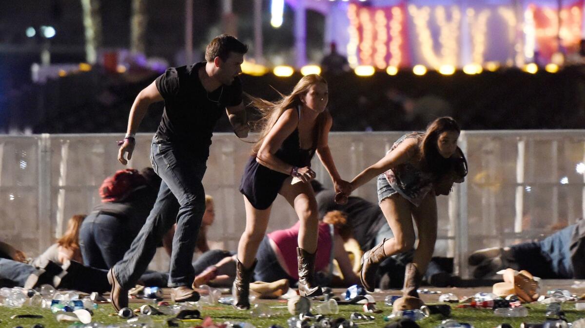People flee from gunfire at the Route 91 Harvest country music festival.
