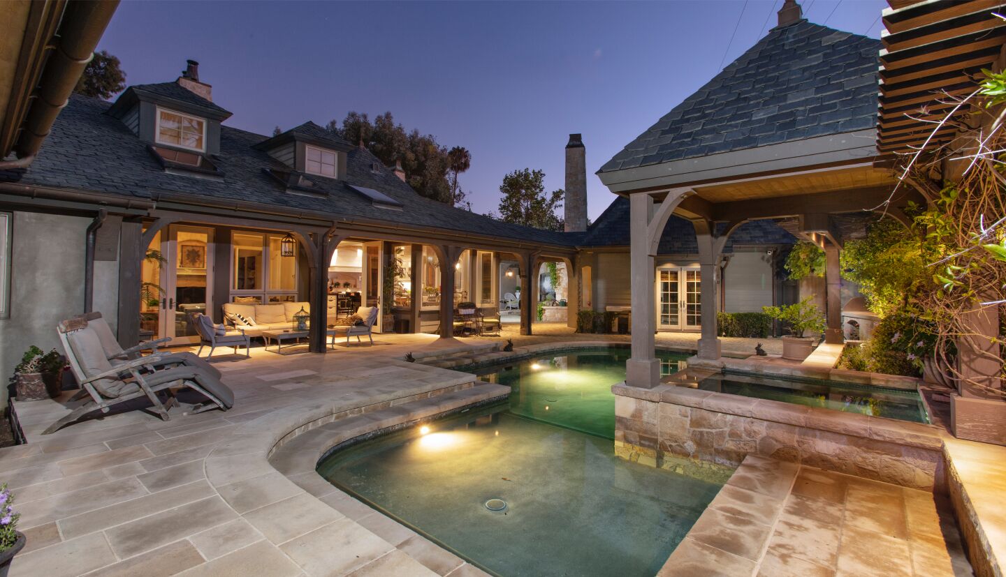 The back patio with a swimming pool.