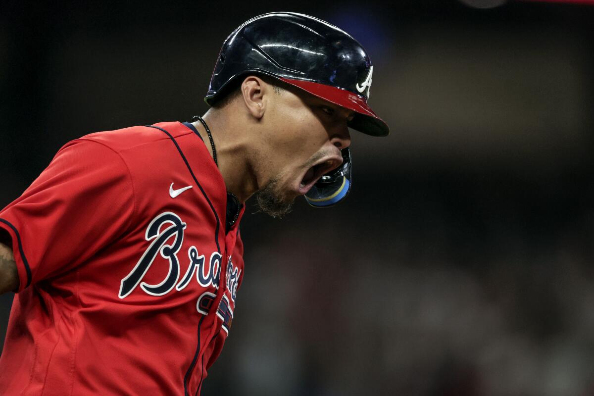 The Braves' Orlando Arcia is fired up after hitting a three-run home run against the Angels on July 22, 2022.