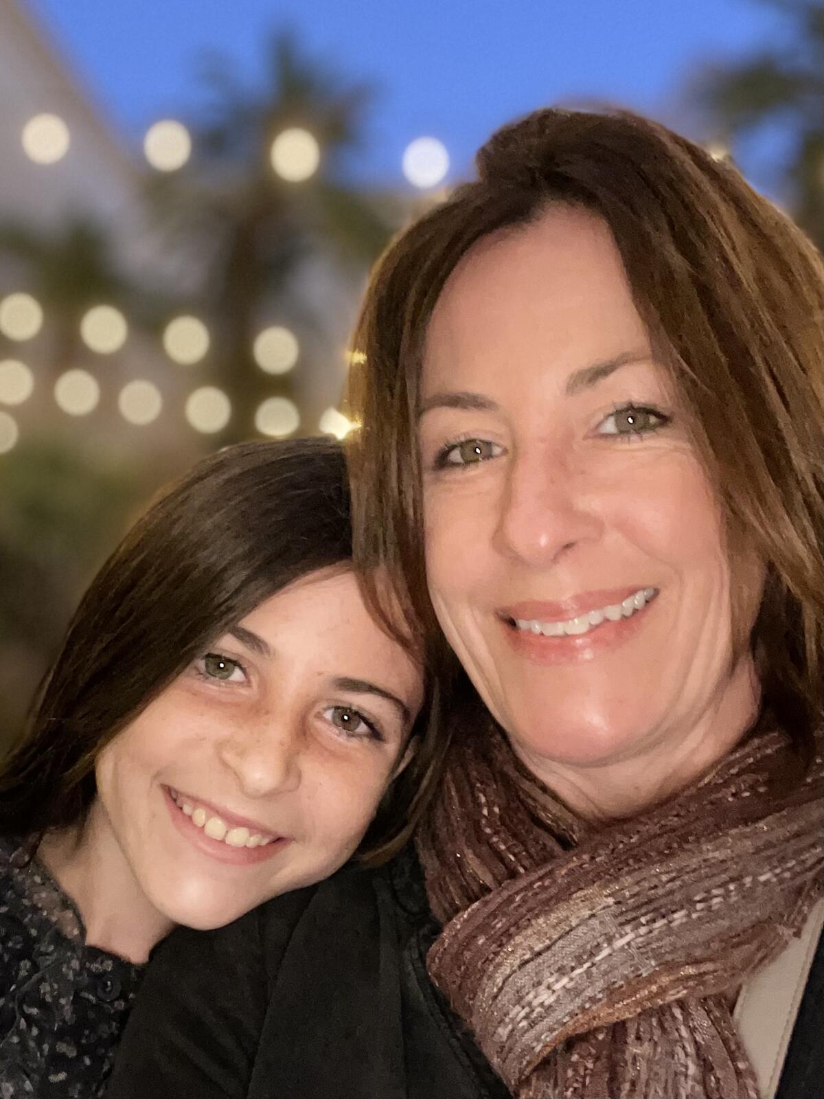 Olivia and Carmen Isaacs do a mother-daughter holiday fundraiser every year.