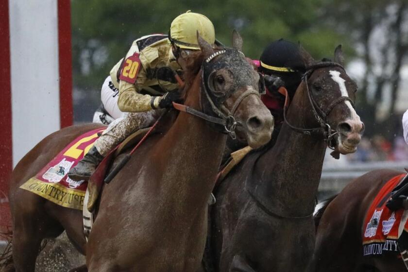 Flavien Prat on Country House, left, races against Luis Saez on Maximum Security, second from right, during the 145th running of the Kentucky Derby horse race at Churchill Downs Saturday, May 4, 2019, in Louisville, Ky. Maximum Security was disqualified and Country House won the race. (AP Photo/John Minchillo)