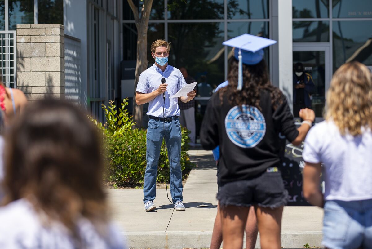 Henry Hobin, 18, the senior class president at Corona del Mar High School, speaks during a protest of the Newport-Mesa Unified School District's decision to not hold in-person graduation ceremonies this year because of the COVID-19 pandemic.