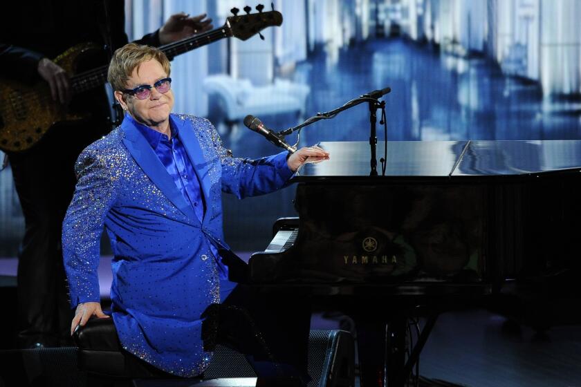 Elton John performs "Home Again" at the 65th Primetime Emmy Awards at the Nokia Theatre.