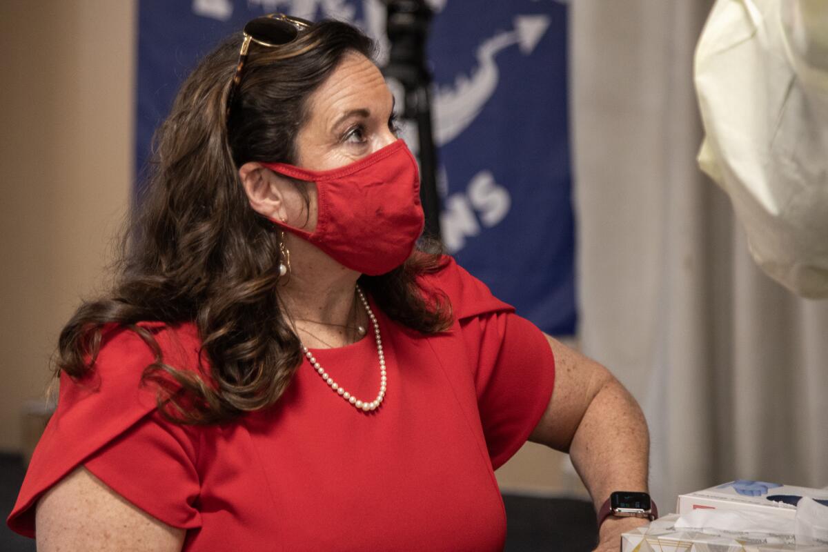 Cindy Marten is pictured, masked, inside a San Diego County elementary school.