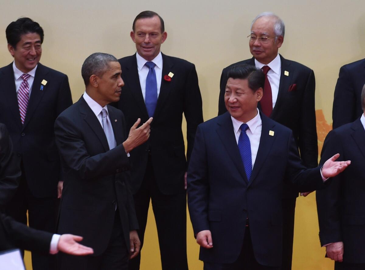 President Obama at the Asia-Pacific Economic Cooperation summit with Chinese President Xi Jinping, right, Japan's Prime Minister Shinzo Abe, top left, Australia's Prime Minister Tony Abbott, center, and Malaysia Prime Minister Najib Razak.