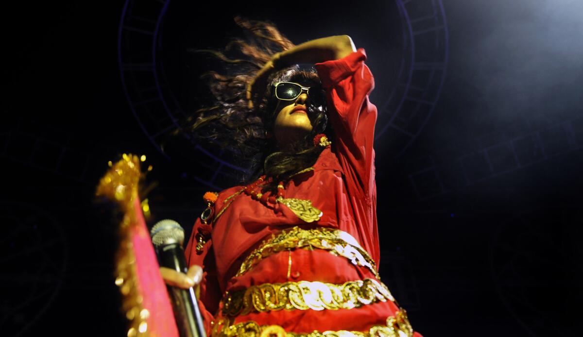 M.I.A., whose new album is called "AIM," performs in Los Angeles in 2013.