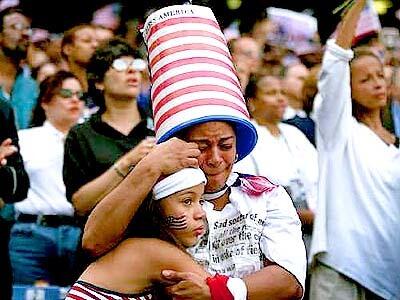 Frances Ortega of the Bronx, NY, sheds a tear and leans on her daughter