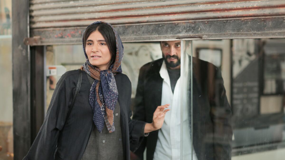 Sahar Goldoust and Amir Jadidi in a scene from "A Hero." 