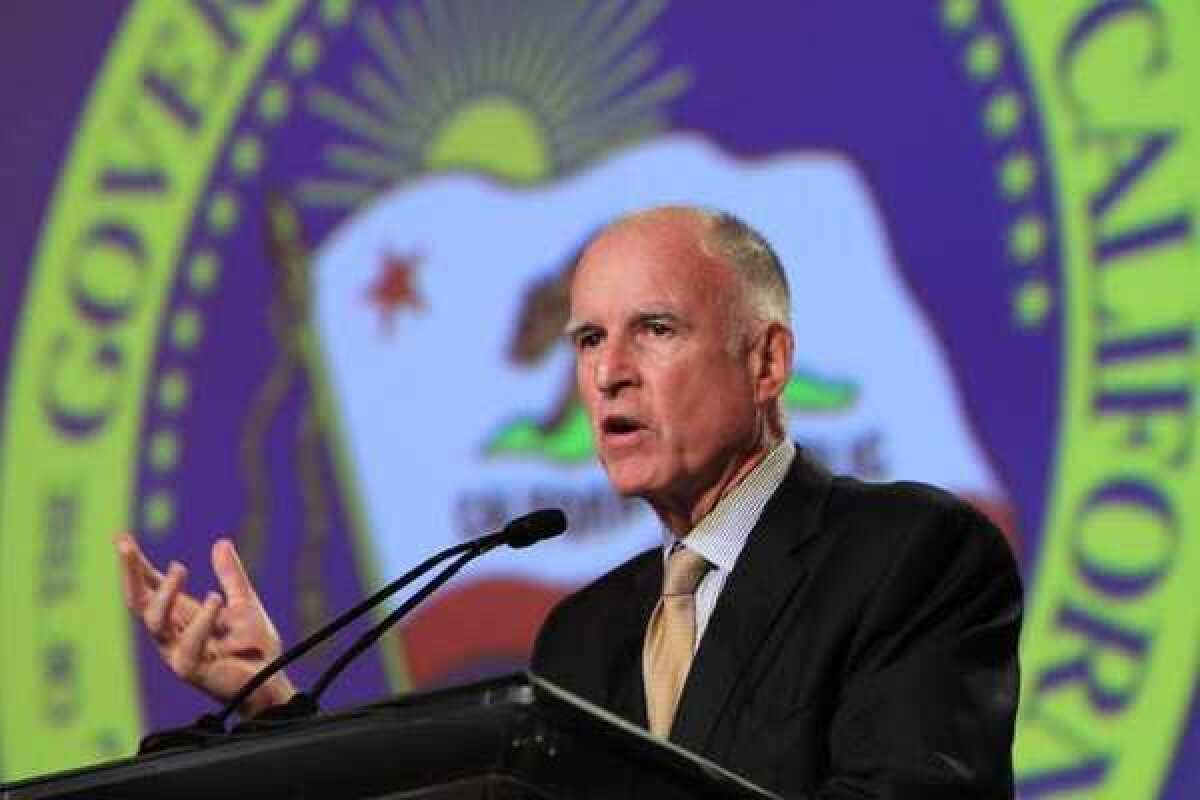 Gov. Jerry Brown discusses his proposed tax initiative during his appearance at the 87th annual Sacramento Host Breakfast.