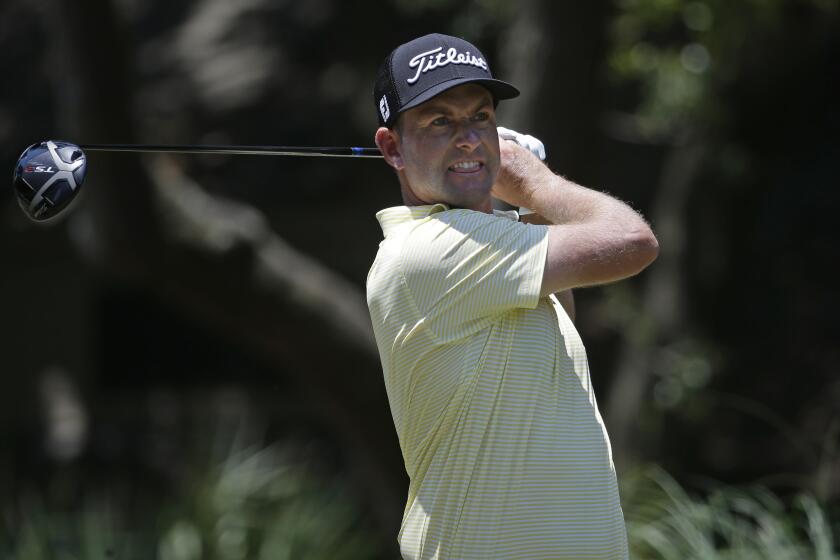Webb Simpson hits off the second tee during the final round of the RBC Heritage golf tournament.