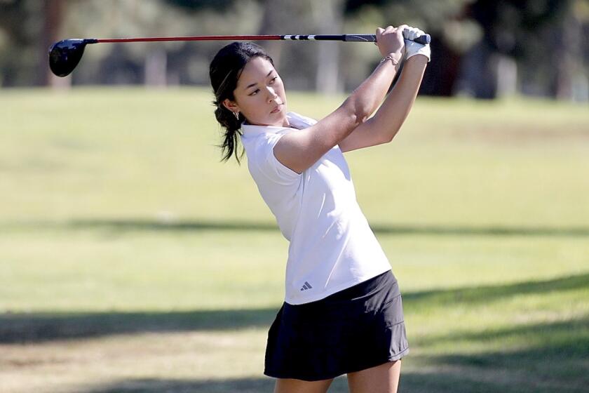 Palisades junior Anna Song hits from the 18th tee during the City Section Championships at Balboa Golf Course in Encino.