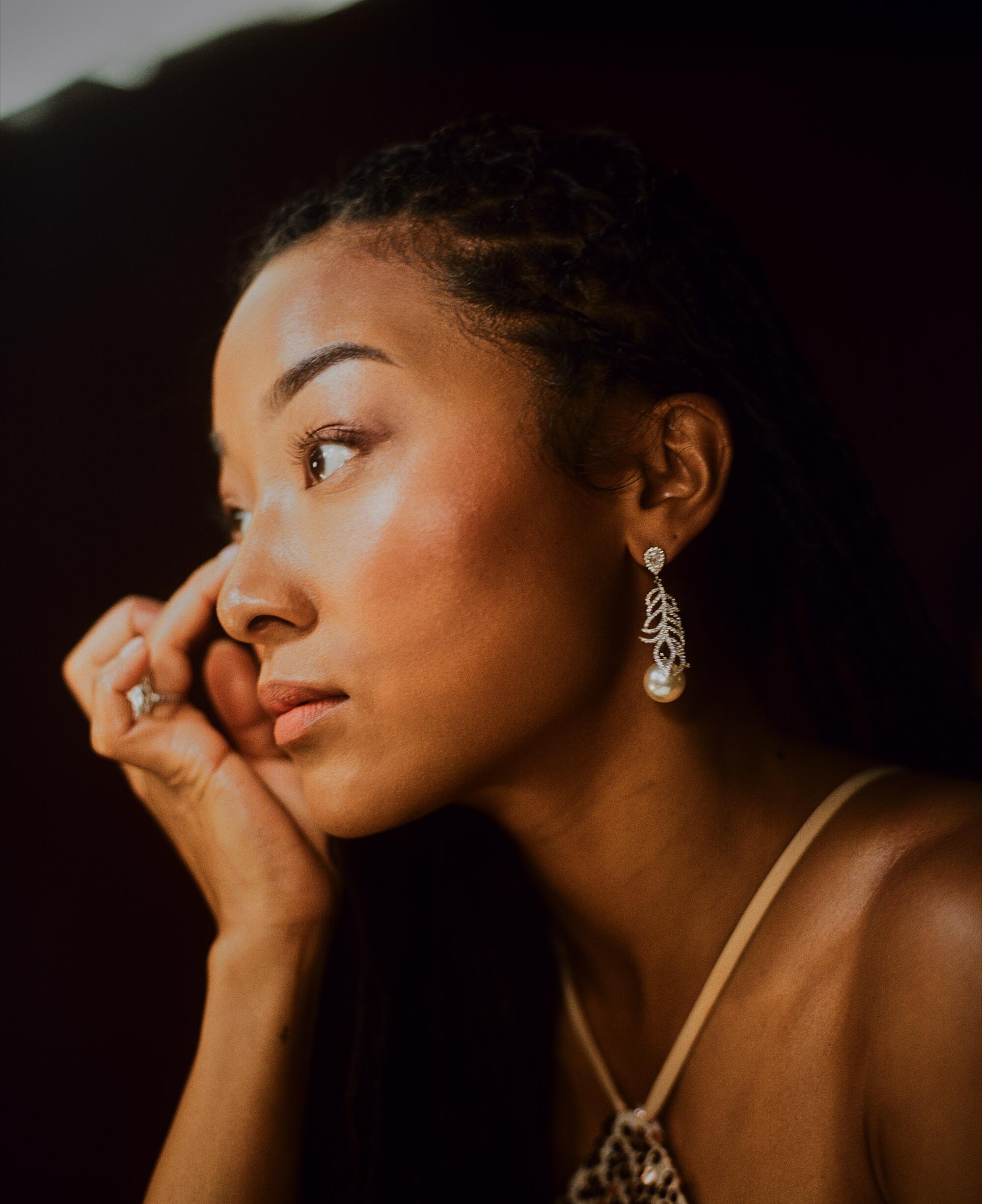 Blair wears a vintage Edwardian 18k white gold diamond ring from the IO Collective private collection and vintage pearl earrings