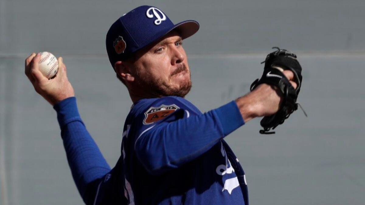 Dodgers left-hander Scott Kazmir throws during a spring training workout on Feb. 14 in Glendale, Ariz.