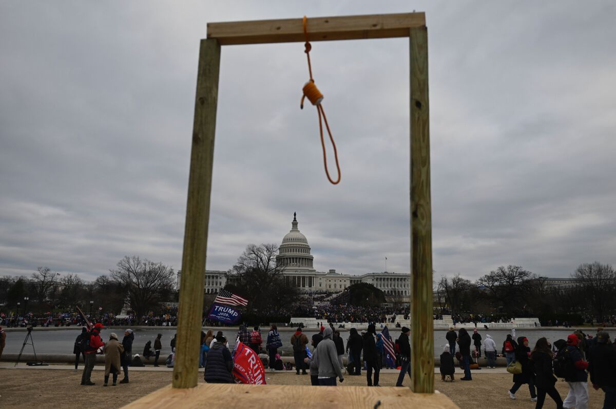 A noose attached to a wooden beam was erected outside the U.S. Capitol as backers of President Trump stormed inside Jan. 6. 